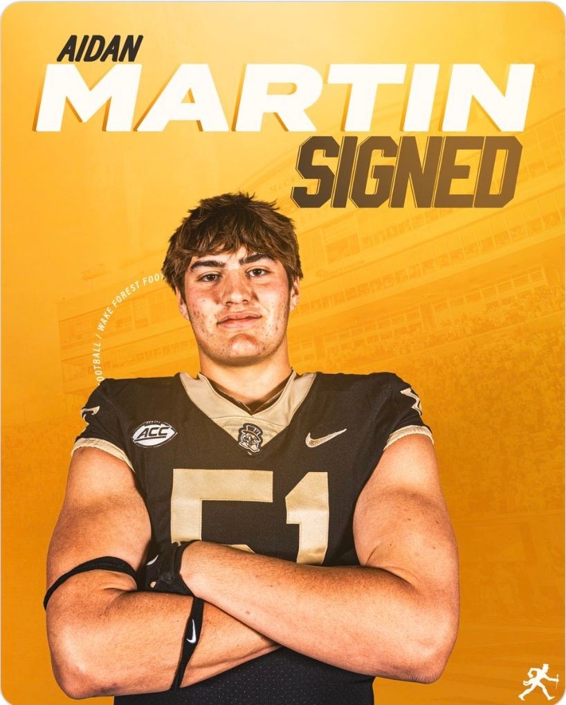 Football player in uniform with arms crossed, text 'SIGNED' on an orange background.